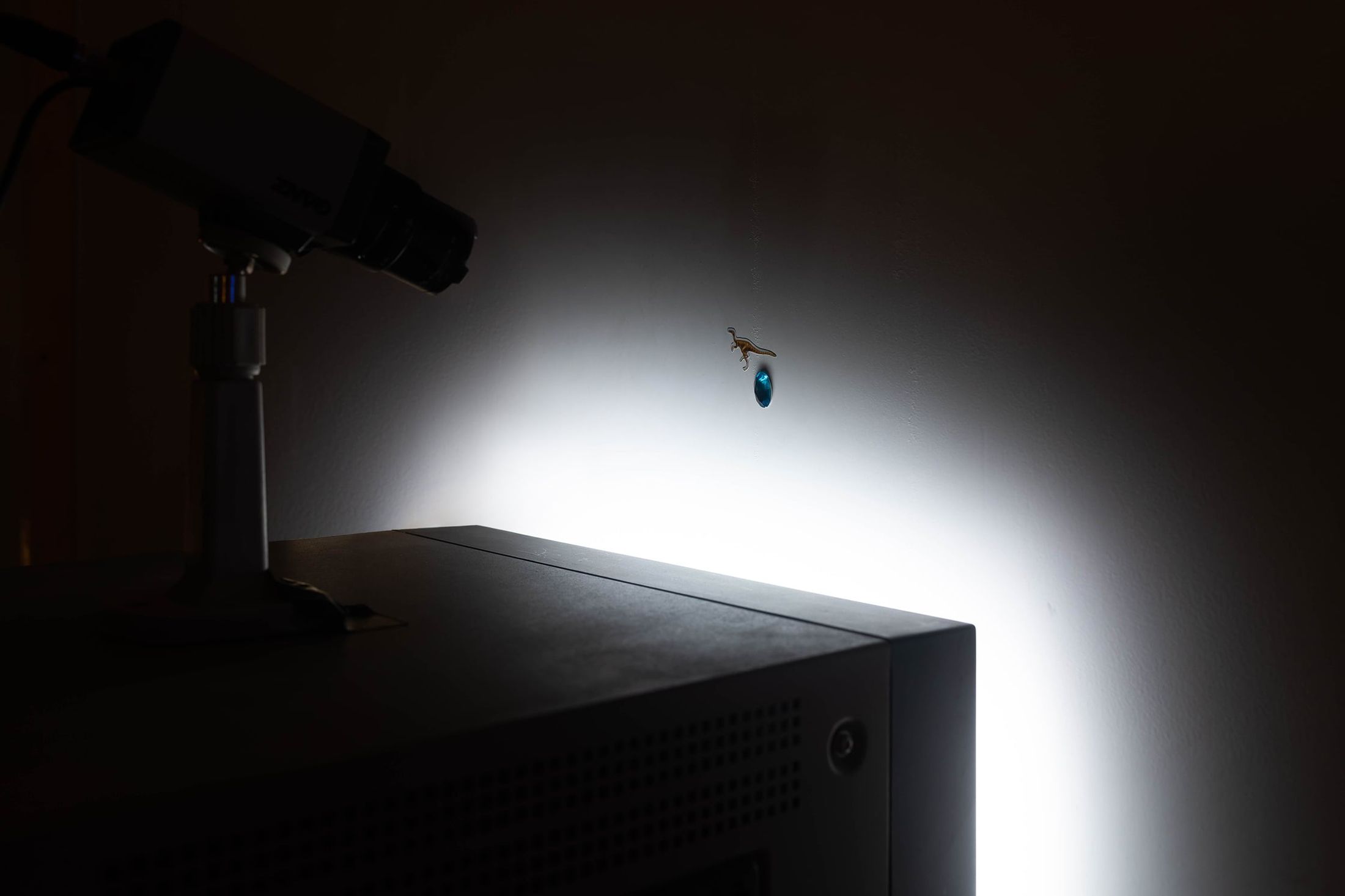 Close-up view of the CCTV camera filming the back of the wall of Invisible Wall (2021) by Melle Nieling